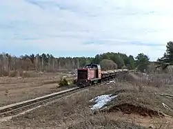 Locomotive TU7-1703 with freight train