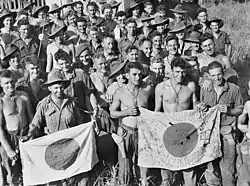 Image 79Australian soldiers display Japanese flags they captured at Kaiapit, New Guinea in 1943 (from History of the Australian Army)