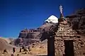 Monuments and Mount Kailash near the lake