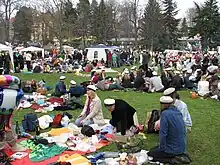 People having a Vappu picnic in Kaivopuisto.