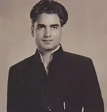 Black-and-white portrait of Amrohi looking directly at the camera