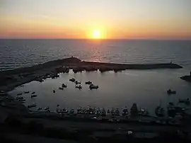 Port of Karaburun and the cape with the lighthouse  (far left)