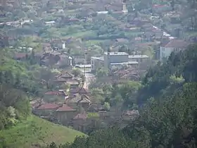 A view of the center of Katselovo, BG from the hillside to the North. Showing the Church tower (center left), the Cultural Center (large grey building) and what was the school (center right).