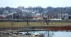 Kaukauna's south side downtown, as seen from Statue Park. The Fox River is in the foreground and the Civic Center is on the far right.