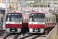 A pair of 4-car trains on standby for addition to 8-car northbound services