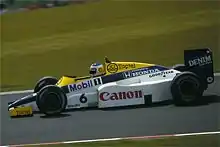 Keke Rosberg driving the FW10, also at the German Grand Prix, in which he finished twelfth.