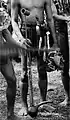 Dayak musician holding mouth organ in Tenggarong, Borneo, early 20th century.