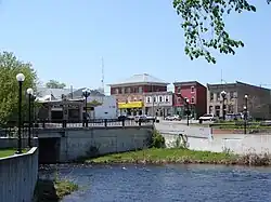 Old brick buildings and a bridge over the Kemptville Creek