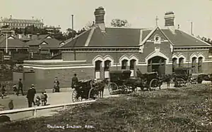 The street side of the former Kew station. Xavier College in background.