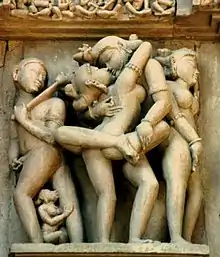 Erotic sculpture at Khajuraho Temple walls