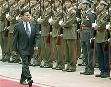 Khin Nyunt reviews a Vietnamese honor guard at the Presidential Palace in Hanoi, Vietnam, Monday 9 August 2004