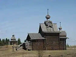 Architectural-ethnographic museum "Khokhlovka" in Perm Krai. Church of Transformation of the Lord (1707) and a watchtower (17th century).