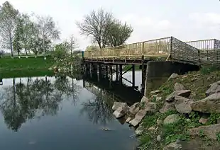 Image 6A wooden bridge leads to the entrance to the Khomutovska Steppe in Donetsk Oblast.