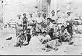 Members of Palmach posing amongst the ruins. Khulda April 1948