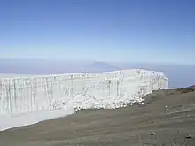 The summit of Mount Meru seen from the summit of Mount Kilimanjaro.