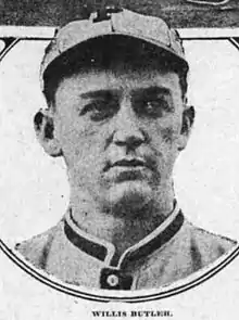 A man in a light-colored baseball uniform and a cap with a "P" on the front looks–the right.