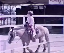 Child riding a pony, Ponyland, Los Angeles, California, U.S.