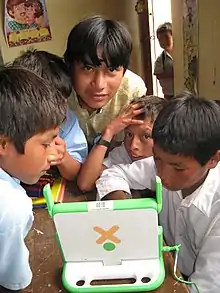 Image 31Peruvian school children with an OLPC XO-1 laptop (from Demographics of Peru)