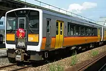 A JR East KiHa E120 DMU at Imaizumi Station in July 2009