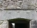 Carved lintel over the door