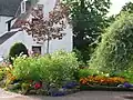 The gable end of the house and a garden feature.