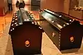 Replicas of the royal coffins.  Nails, other metal artifacts, and portions of the wood survive.