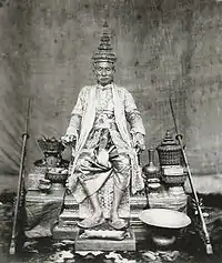 King Mongkut wears the Gown of the Great House of Chakri, the Great Crown of Victory and the Royal Slippers; photo taken around 1851.