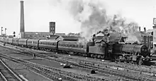 Special 'Illuminations' Express to Blackpool, 1962, with Wesham's Phoenix Mill in the background.