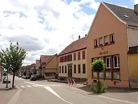 The town hall and main street in Kirrwiller