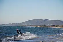 Kitesurfing at Rye, Arthurs Seat in background