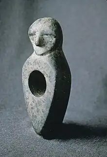 Stone age axe head with a human figure, Kiuruvesi