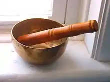  An image of a sound bowl with a wooden striker