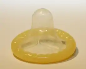 A rolled up male condom.