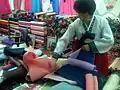 A seller at a hanbok store in the market