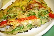 Haemul pajeon is a variety of pajeon in Korean cuisine made with flour, scallion and seafood