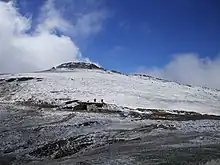 Mount Etheridge from south side showing high elevation toilet at Rawson Pass