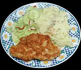 Kotlet z indyka turkey cutlet with spring onion mashed potato, cucumber and radish salad.