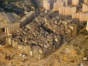 Image 25By 1990, the Kowloon Walled City contained 50,000 residents within its 2.6-hectare (6.4-acre) borders. (from History of Hong Kong)