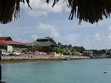 View of waterfront including Fish Market and World War II Monument on the right.