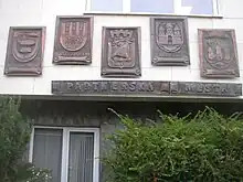 Insignia of twin towns on town hall in Kralupy nad Vltavou, Czech Republic