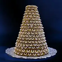 A pastry built out of 18 rings.  Each ring is slightly smaller than the next, and they are stacked to form a tower