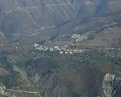 Krastë seen from the summit of Noi i Madh (1848 m), at a distance of 7.7 km (5 mi) as the crow flies.