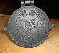 19th century krumkake iron decorated with national coat of arms