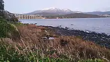 Winter views of a snow covered kunanyi / Mount Wellington, taken at the end of Yolla Street and the start of the Esplanade along the Rose Bay foreshore trail.