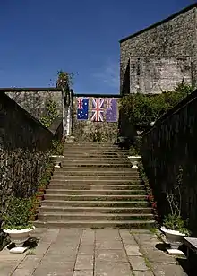 Three flags dedicated to Australian, British and New Zealander soldiers in Kundasang War Memorial, Ranau, Sabah, Malaysia.