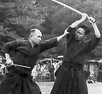 Kuroda Ichitaro (left) and Kaminoda Tsunemori (right) performing Ikkaku-ryu Juttejutsu