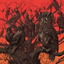 An owl with blank white eyes sitting in a large leafless tree surrounded by falcons with hoods on