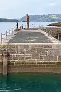 "LOOK II" (2020), a permanent cast iron sculpture by Antony Gormley on West Hoe Pier, Plymouth