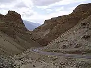 A mountain road in Ladakh that shows signs of mass wasting and erosion that result in bedrock exposure.