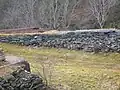 Quarry and embankment with old rails